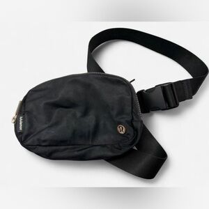 Black Lululemon Fanny Pack. Needs wash, slight tarnishing on the metal emblem